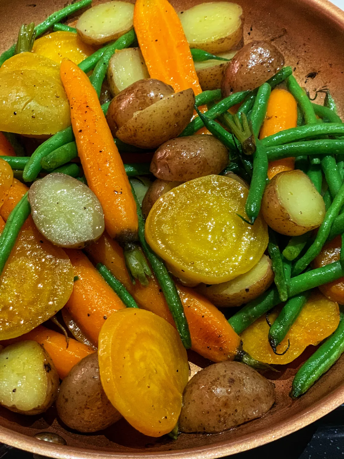 Seasonal vegetables — golden beets, carrots, green beans and baby potatoes prepared in the kitchen at Paris Crêpes Café